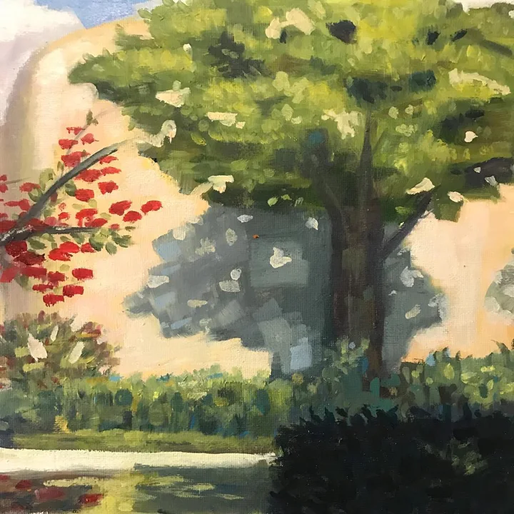 Oil painting of a broad green tree beside a branch of red blossoms, with hedges and still water below.