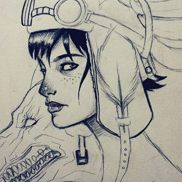 Ink sketch of a freckled woman in an aviator cap with goggles, glancing to the side.