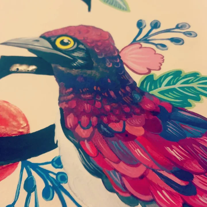 Gouache painting of a crimson and blue bird with a yellow eye among pink blossoms, leaves, and blue berry sprigs.